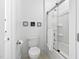 Bathroom featuring glass shower and humorous wall decorations at 2521 Georgianna Dr, Wake Forest, NC 27587
