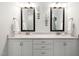 Bright bathroom features double vanity with marble countertop and matching framed mirrors at 2521 Georgianna Dr, Wake Forest, NC 27587