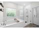 Modern bathroom featuring garden tub and glass enclosed shower at 2521 Georgianna Dr, Wake Forest, NC 27587