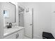 Bathroom vanity featuring marble countertop and stainless steel faucet at 2521 Georgianna Dr, Wake Forest, NC 27587