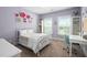 Charming bedroom with purple walls, white furniture, and carpeted floor at 2521 Georgianna Dr, Wake Forest, NC 27587