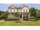 Charming two-story home with stone accents, well-maintained landscaping, and a welcoming front porch at 2521 Georgianna Dr, Wake Forest, NC 27587