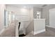 Upstairs hallway with new carpet, white trim, with an upper view into a bedroom at 2521 Georgianna Dr, Wake Forest, NC 27587