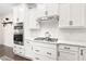 A kitchen featuring stainless steel appliances, white cabinets and a gas stovetop at 2521 Georgianna Dr, Wake Forest, NC 27587