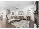 Cozy living room with comfortable seating, a decorative rug, and a stone fireplace at 2521 Georgianna Dr, Wake Forest, NC 27587