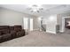 Spacious living room area with neutral walls, new carpet, and plush leather furniture at 2521 Georgianna Dr, Wake Forest, NC 27587