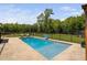 Sparkling in-ground pool with lounge area and a fully fenced yard, ideal for summer fun at 2521 Georgianna Dr, Wake Forest, NC 27587