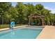 Inviting pool area with a covered pergola, perfect for entertaining guests and enjoying outdoor activities at 2521 Georgianna Dr, Wake Forest, NC 27587