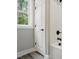 Bathroom area showing a tub and shower, a window, and a door at 2921 Wall Store Rd, Garner, NC 27529