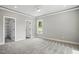 Spacious bedroom with neutral carpet, gray walls, recessed lighting and large window at 2921 Wall Store Rd, Garner, NC 27529