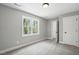 Bedroom with neutral tones, large windows, carpet, and closet space at 2921 Wall Store Rd, Garner, NC 27529