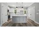Well-designed kitchen with an island, stainless steel appliances and sleek white cabinets at 2921 Wall Store Rd, Garner, NC 27529