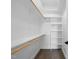Walk in closet features shelving, hanging rods, and a small window for natural light at 2921 Wall Store Rd, Garner, NC 27529