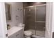Modern bathroom features gray vanity with framed shower door at 3030 Forrester St, Durham, NC 27704