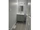 Bathroom featuring a gray vanity, modern finishes and light fixture at 3030 Forrester St, Durham, NC 27704
