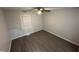Bedroom with gray walls, hardwood floors, neutral paint, and bright natural light at 3030 Forrester St, Durham, NC 27704
