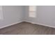 Neutral bedroom showcasing wood-look floors and bright natural light at 3030 Forrester St, Durham, NC 27704