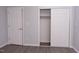 Bedroom featuring wood-look floors and a double closet at 3030 Forrester St, Durham, NC 27704