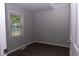 Bedroom featuring wood-look floors and a window with natural light at 3030 Forrester St, Durham, NC 27704