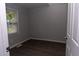 Bedroom featuring wood-look floors and a window with natural light at 3030 Forrester St, Durham, NC 27704