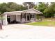 Well-maintained home with a front porch and a large concrete driveway leading to the entrance at 3030 Forrester St, Durham, NC 27704
