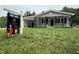 Charming single-story home with an inviting covered porch and a 'For Sale' sign at 3030 Forrester St, Durham, NC 27704