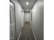 Hallway features gray walls, and wood-look flooring at 3030 Forrester St, Durham, NC 27704