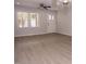 Living room with hardwood floors, neutral paint, bright natural light, and a ceiling fan at 3030 Forrester St, Durham, NC 27704
