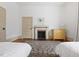 Relaxing bedroom with hardwood floors, fireplace, and neutral walls, creating a comfortable retreat at 304 Linden Ave, Raleigh, NC 27601
