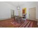 Light-filled dining room with modern chandelier, wood floors and fireplace at 304 Linden Ave, Raleigh, NC 27601
