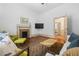 Comfortable living room featuring fireplace, wood floors, and TV at 304 Linden Ave, Raleigh, NC 27601