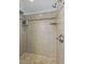 Walk in shower featuring mosaic design accent tile and chrome shower head at 304 Linden Ave, Raleigh, NC 27601