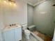 Newly remodeled bathroom featuring a modern vanity, toilet and walk-in shower with tiled walls and floor at 323 Hudson St, Raleigh, NC 27608