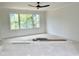 Bright bedroom features a ceiling fan, large window offering abundant natural light and great outdoor views at 323 Hudson St, Raleigh, NC 27608