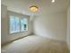 Bedroom features a window providing great outdoor views and natural light plus neutral walls and trim at 323 Hudson St, Raleigh, NC 27608
