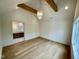 Bedroom with wooden beams, chandelier and wooden floors at 323 Hudson St, Raleigh, NC 27608