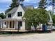 Beautiful new construction home with stone and shingle exterior and black framed windows at 323 Hudson St, Raleigh, NC 27608