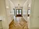 View of hallway with beautiful herringbone wood floors and lantern style light fixture at 323 Hudson St, Raleigh, NC 27608