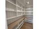 Spacious pantry featuring floor to ceiling shelving with a light wood counter and floors at 323 Hudson St, Raleigh, NC 27608