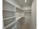 Spacious walk-in closet with custom shelving, ready to be filled at 323 Hudson St, Raleigh, NC 27608