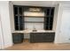 Stylish wet bar features dark cabinets, marble countertops, brass fixtures, and storage at 323 Hudson St, Raleigh, NC 27608