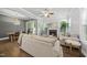 Open concept living room and dining area with fireplace, hardwood floors and plenty of natural light at 359 Ashton Ridge Ln, Cary, NC 27513