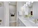 Bathroom featuring dual sinks with white cabinets and a shower with a decorative curtain at 361 Murray Grey Ln, Wake Forest, NC 27587