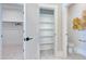 Well-lit bathroom featuring white cabinets, marble floor, a closet and a water closet at 361 Murray Grey Ln, Wake Forest, NC 27587