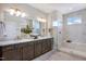 Stylish bathroom with a double sink vanity, elegant lighting, and a luxurious glass shower at 361 Murray Grey Ln, Wake Forest, NC 27587