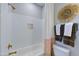Bright bathroom features white subway tile, a gold shower head, and decorative accents at 361 Murray Grey Ln, Wake Forest, NC 27587