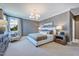 Elegant bedroom boasts a comfortable bed, stylish furnishings, and plenty of natural light at 361 Murray Grey Ln, Wake Forest, NC 27587