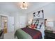 Bright bedroom with a queen bed, sports decor and view to en suite bathroom at 361 Murray Grey Ln, Wake Forest, NC 27587