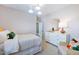 Lovely bedroom featuring white dresser and a chair with colorful decorative pillows at 361 Murray Grey Ln, Wake Forest, NC 27587