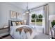Cozy bedroom featuring a comfortable queen bed, natural light, and modern decor at 361 Murray Grey Ln, Wake Forest, NC 27587